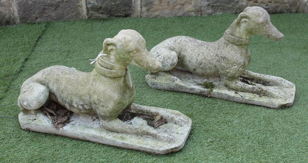 A PAIR OF COMPOSITION STONE GREYHOUNDS Image