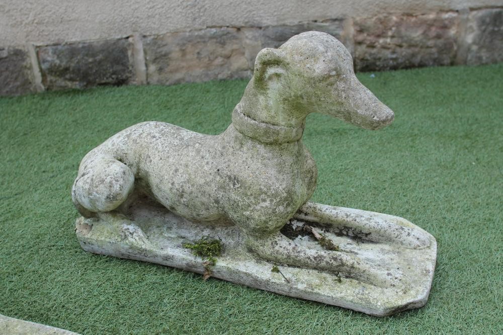 A PAIR OF COMPOSITION STONE GREYHOUNDS Image