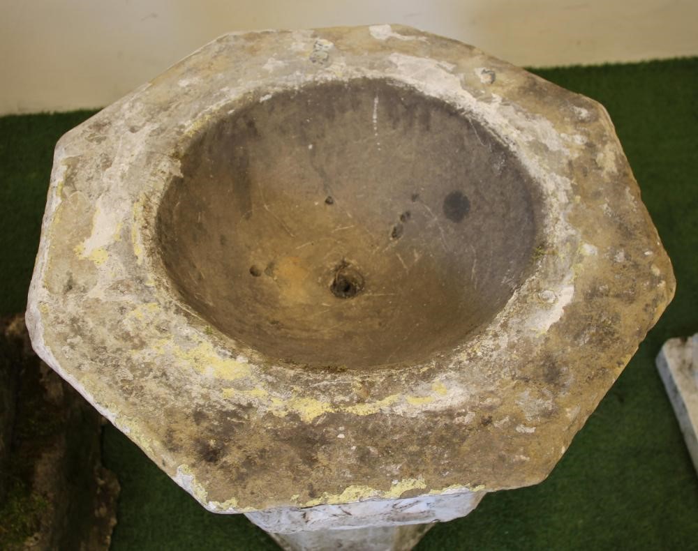 A VICTORIAN SANDSTONE FONT of octagonal form with flared rim Image