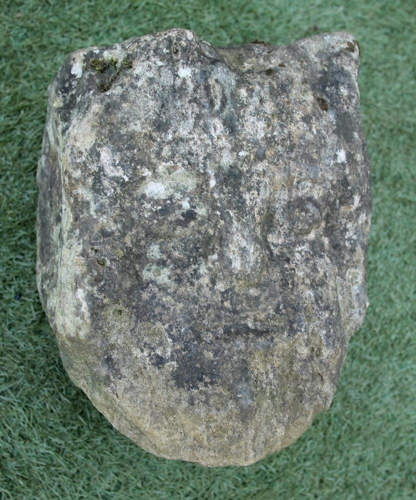 A CARVED SANDSTONE HUMAN HEAD Image