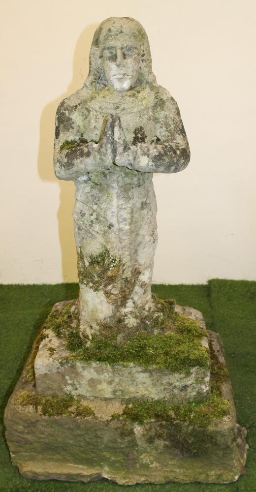 A CARVED SANDSTONE FIGURE OF A CRUSADER modelled standing with hands joined in prayer Image