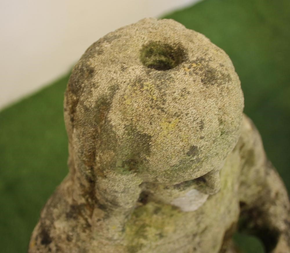 A CARVED SANDSTONE FIGURE OF A CRUSADER modelled standing with hands joined in prayer Image