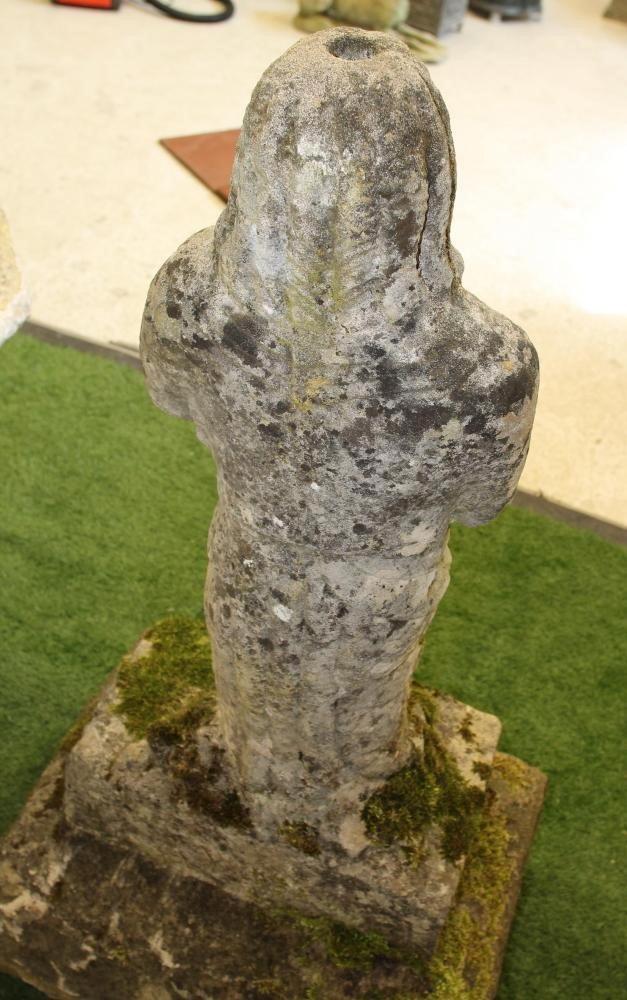 A CARVED SANDSTONE FIGURE OF A CRUSADER modelled standing with hands joined in prayer Image