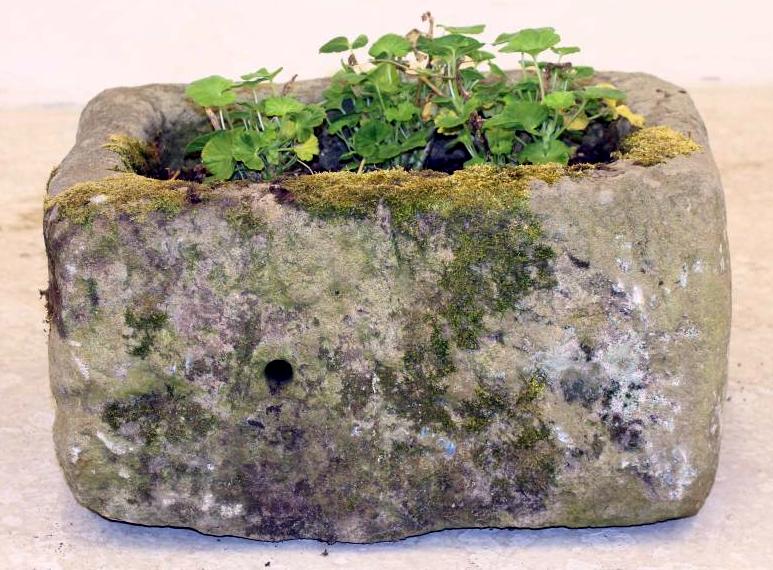 A SANDSTONE TROUGH of rough hewn oblong form Image