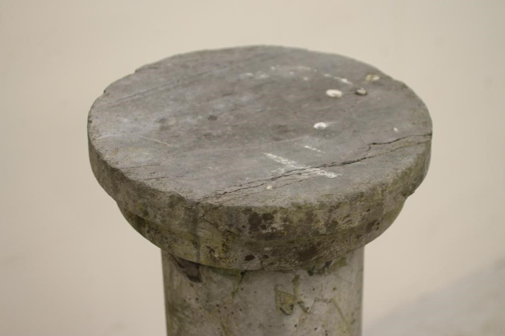 A SANDSTONE COLUMN of plain cylindrical form with stepped and moulded circular top Image