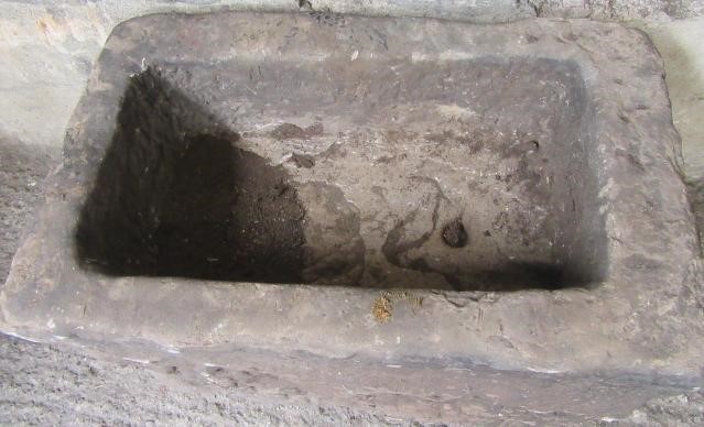 A GRITSTONE MILL TROUGH of rough hewn oblong form Image