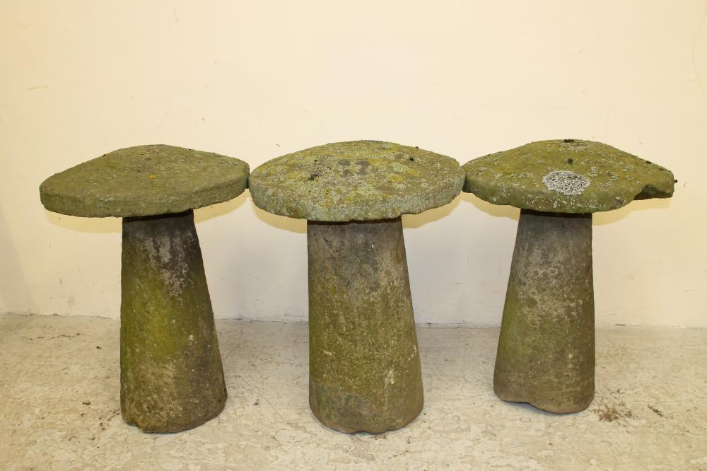 A HARLEQUIN SET OF THREE SANDSTONE STADDLE STONES Image