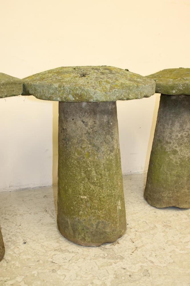 A HARLEQUIN SET OF THREE SANDSTONE STADDLE STONES Image