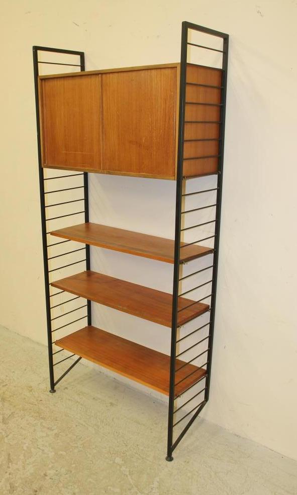 A LADDERAX TEAK UNIT comprising a cupboard with two sliding doors enclosing shelving Image
