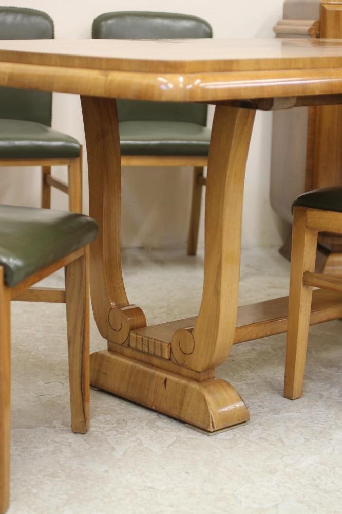 AN ART DECO BURR WALNUT DINING SUITE comprising extending dining table of rounded oblong form with Image
