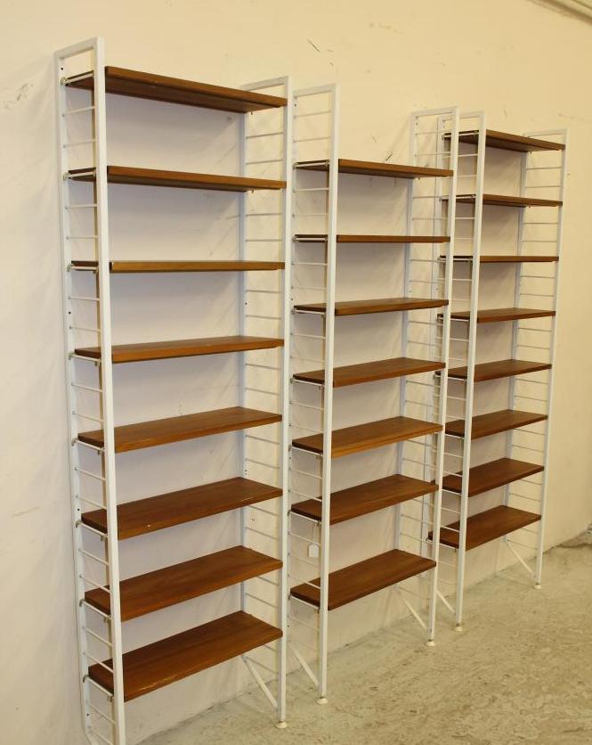 A LADDERAX TEAK SHELVING UNIT comprising twenty three open shelves Image