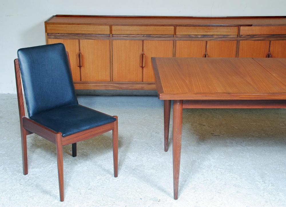A TEAK AND ROSEWOOD BANDED DINING SUITE Image