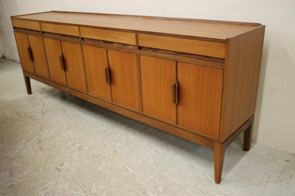 A TEAK AND ROSEWOOD BANDED DINING SUITE Image