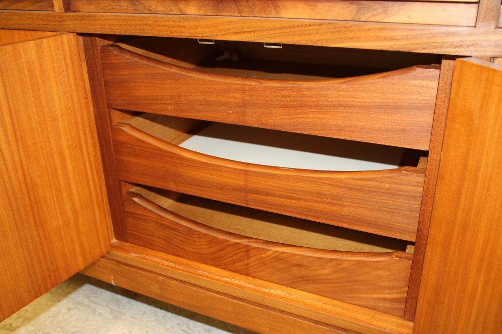 A TEAK AND ROSEWOOD BANDED DINING SUITE Image