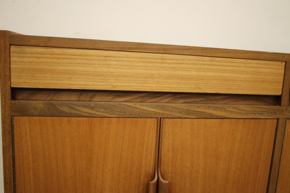 A TEAK AND ROSEWOOD BANDED DINING SUITE Image