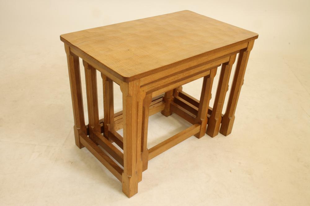 AN ADZED OAK NEST OF THREE TABLES BY ROBERT THOMPSON Image