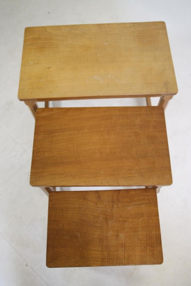 AN ADZED OAK NEST OF THREE TABLES BY ROBERT THOMPSON Image