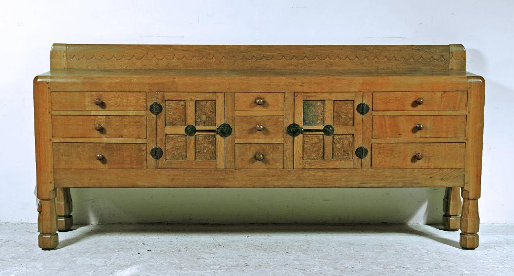 A LARGE ADZED OAK SIDEBOARD BY ROBERT THOMPSON Image