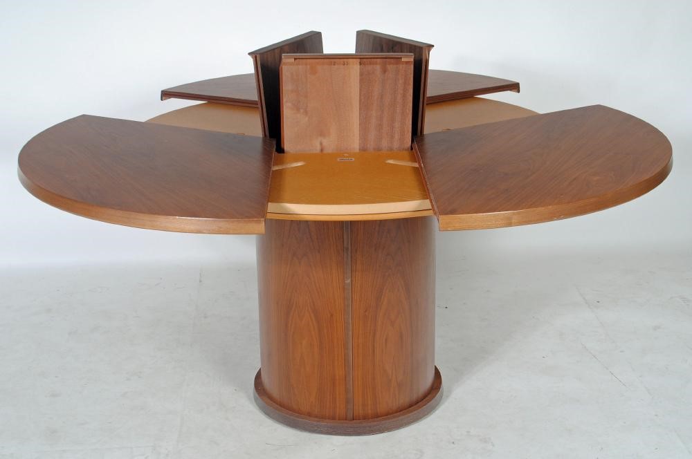 A SKOVBY OF DENMARK EXTENDING HARDWOOD DINING TABLE Image