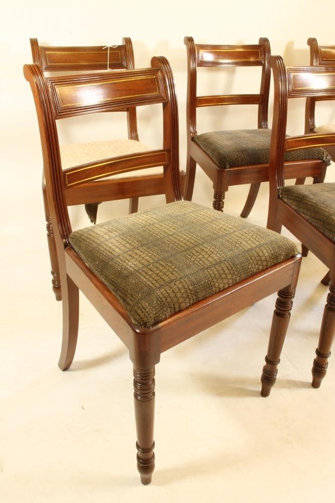 A SET OF SIX REGENCY MAHOGANY AND BRASS INLAID DINING CHAIRS Image