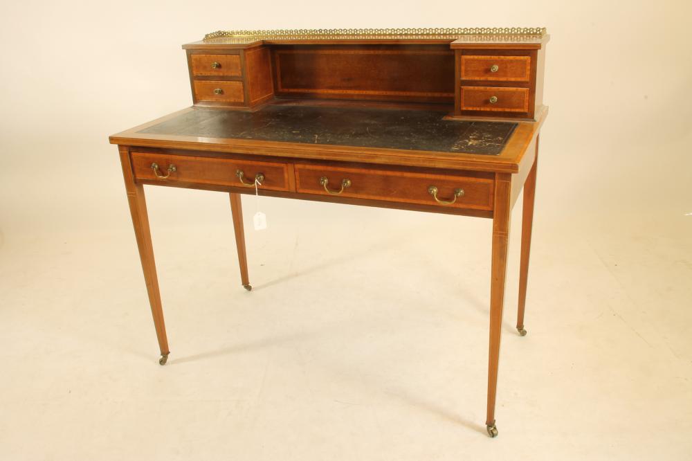 AN EDWARDIAN MAHOGANY DESK crossbanded with stringing Image