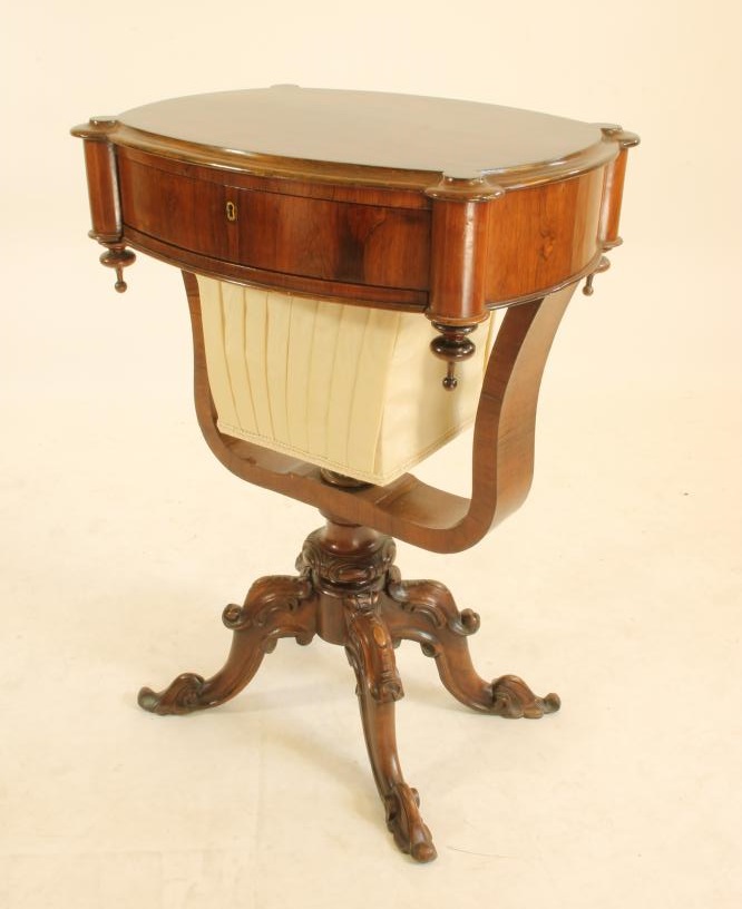 A VICTORIAN ROSEWOOD WORK TABLE of earred oval form Image