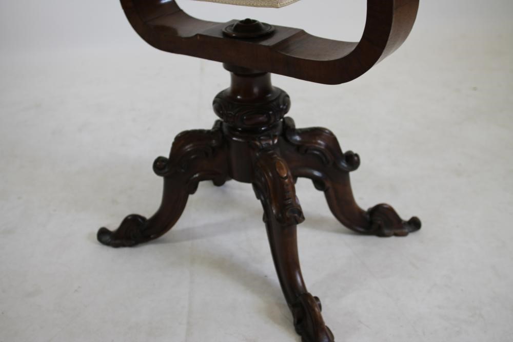 A VICTORIAN ROSEWOOD WORK TABLE of earred oval form Image