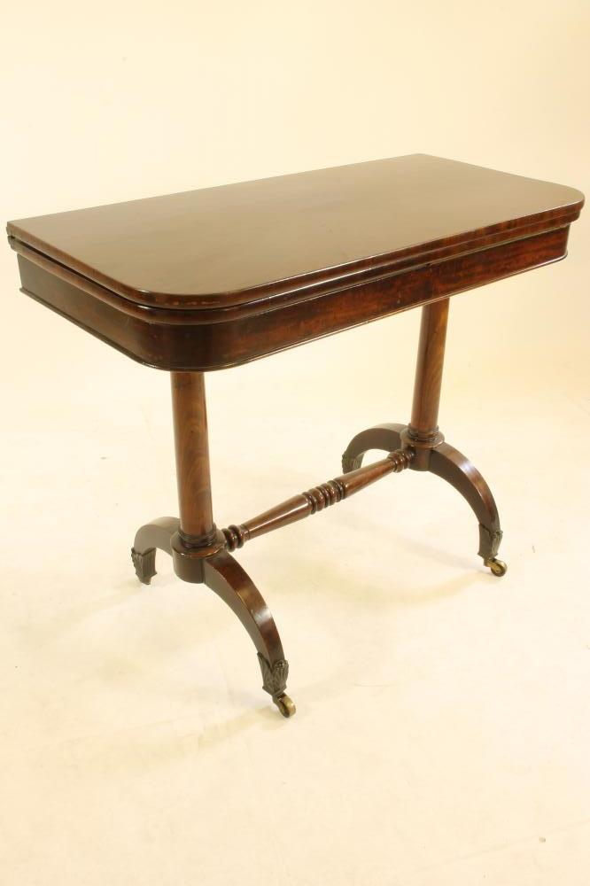 AN EARLY VICTORIAN MAHOGANY FOLDING TEA TABLE of rounded oblong form Image