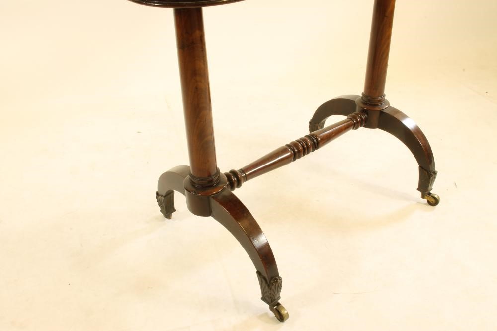 AN EARLY VICTORIAN MAHOGANY FOLDING TEA TABLE of rounded oblong form Image
