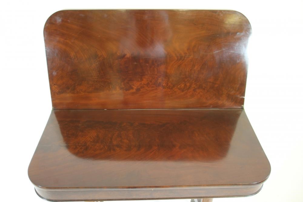 AN EARLY VICTORIAN MAHOGANY FOLDING TEA TABLE of rounded oblong form Image