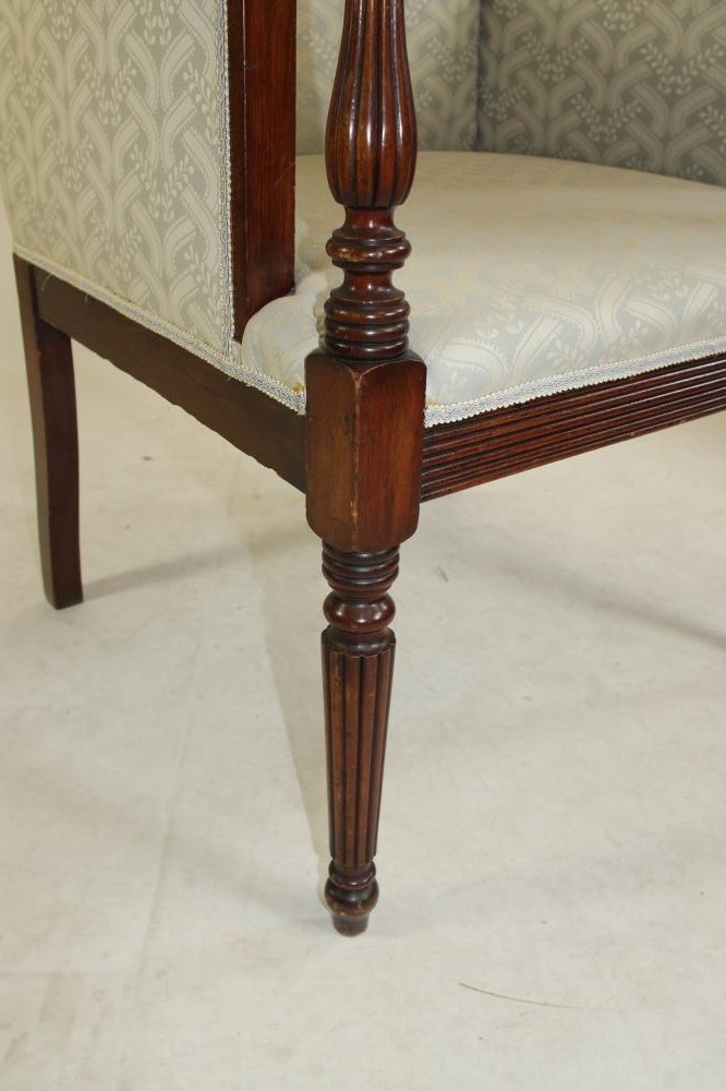 A REGENCY STYLE MAHOGANY LIBRARY CHAIR Image