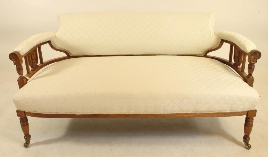 A LATE VICTORIAN ROSEWOOD SOFA of low rounded form Image