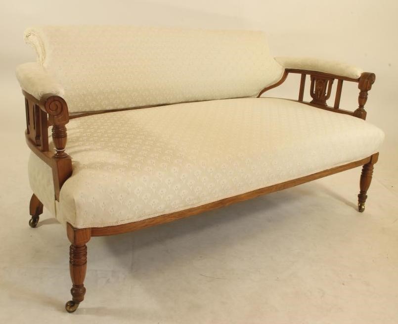 A LATE VICTORIAN ROSEWOOD SOFA of low rounded form Image
