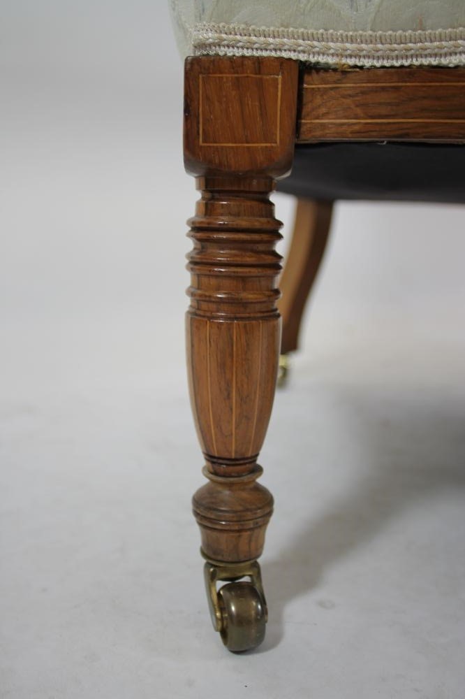 A LATE VICTORIAN ROSEWOOD SOFA of low rounded form Image