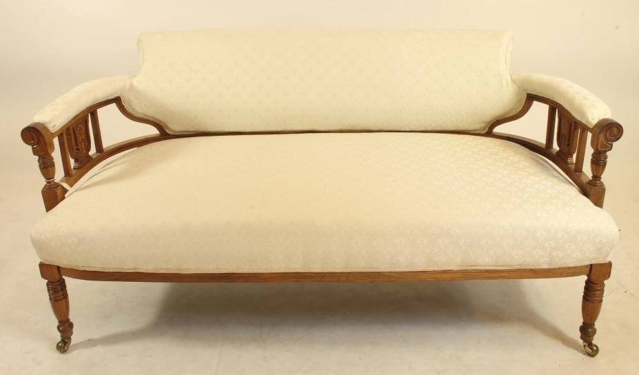 A LATE VICTORIAN ROSEWOOD SOFA of low rounded form Image