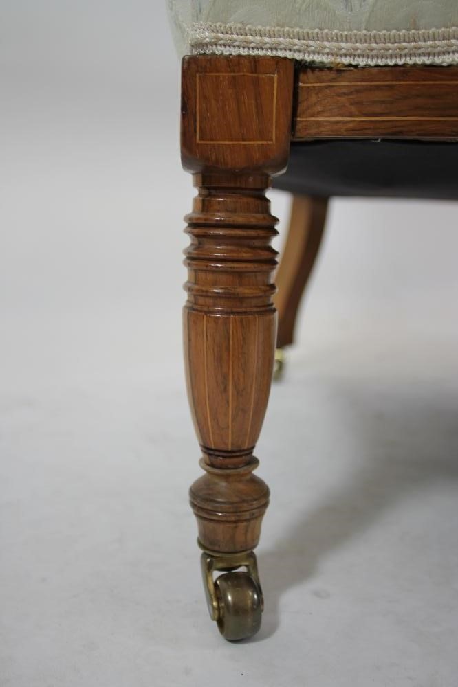 A LATE VICTORIAN ROSEWOOD SOFA of low rounded form Image