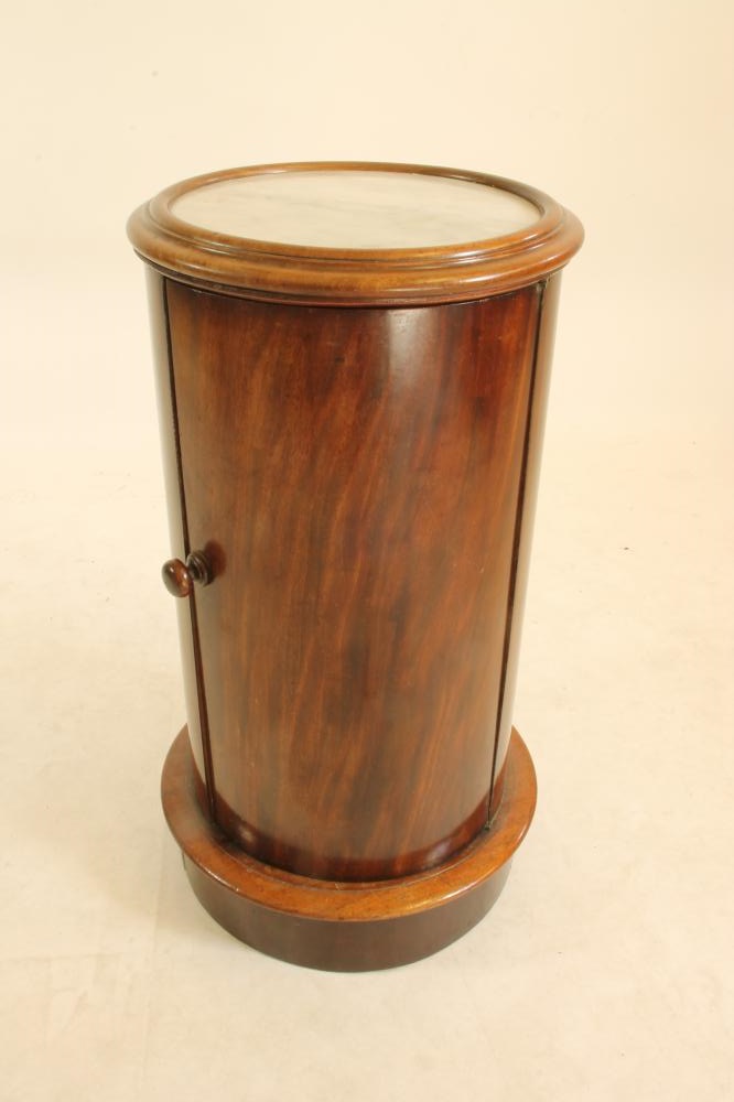 A VICTORIAN MAHOGANY BEDSIDE CUPBOARD of cylindrical form with inset white marble top Image