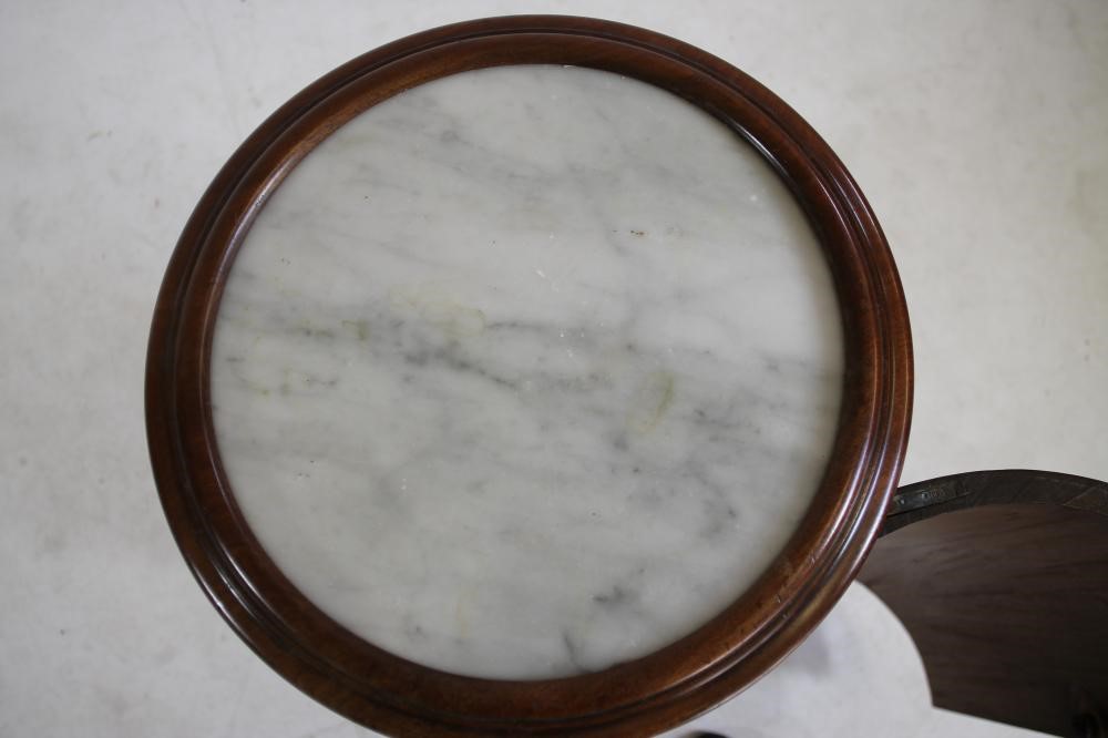 A VICTORIAN MAHOGANY BEDSIDE CUPBOARD of cylindrical form with inset white marble top Image