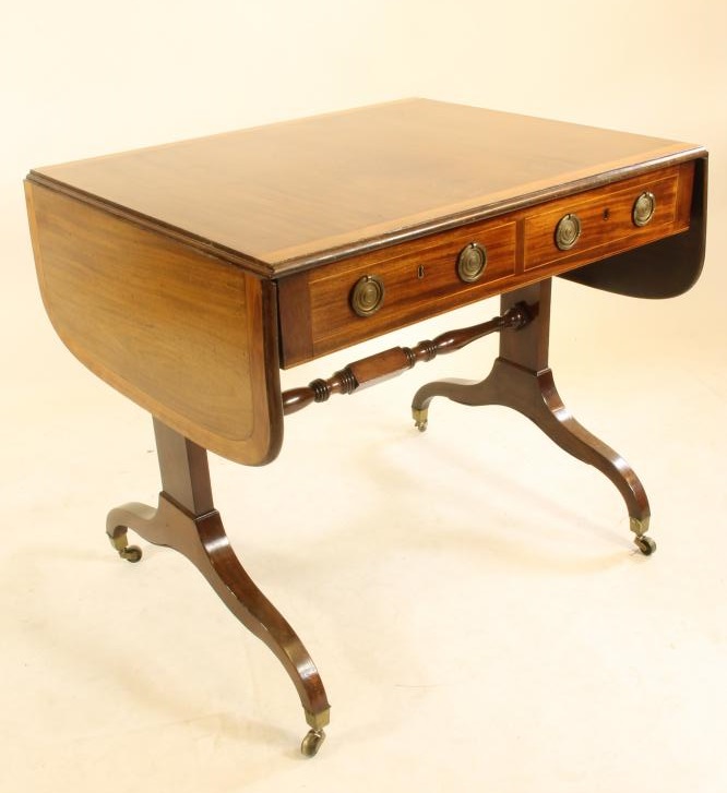 A REGENCY STYLE MAHOGANY AND SATINWOOD BANDED SOFA TABLE Image