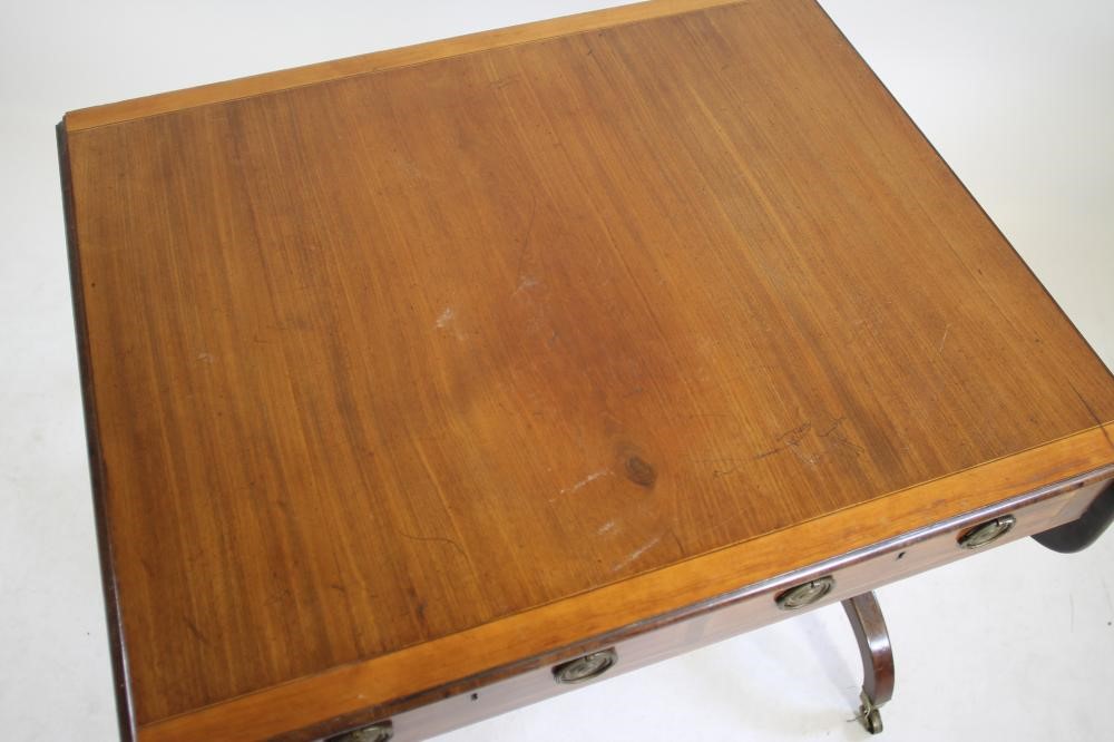 A REGENCY STYLE MAHOGANY AND SATINWOOD BANDED SOFA TABLE Image