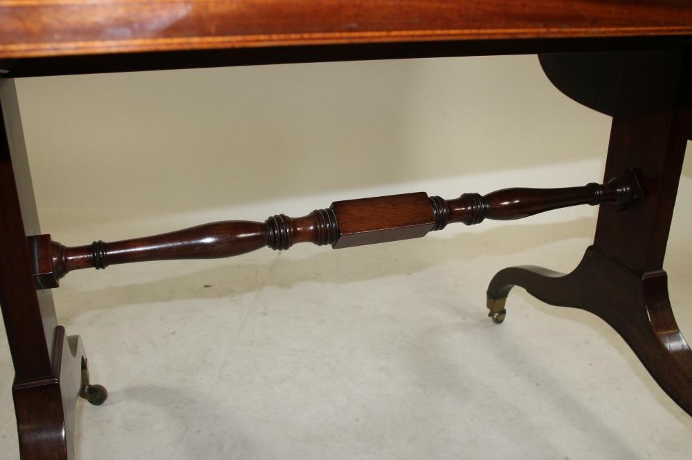 A REGENCY STYLE MAHOGANY AND SATINWOOD BANDED SOFA TABLE Image