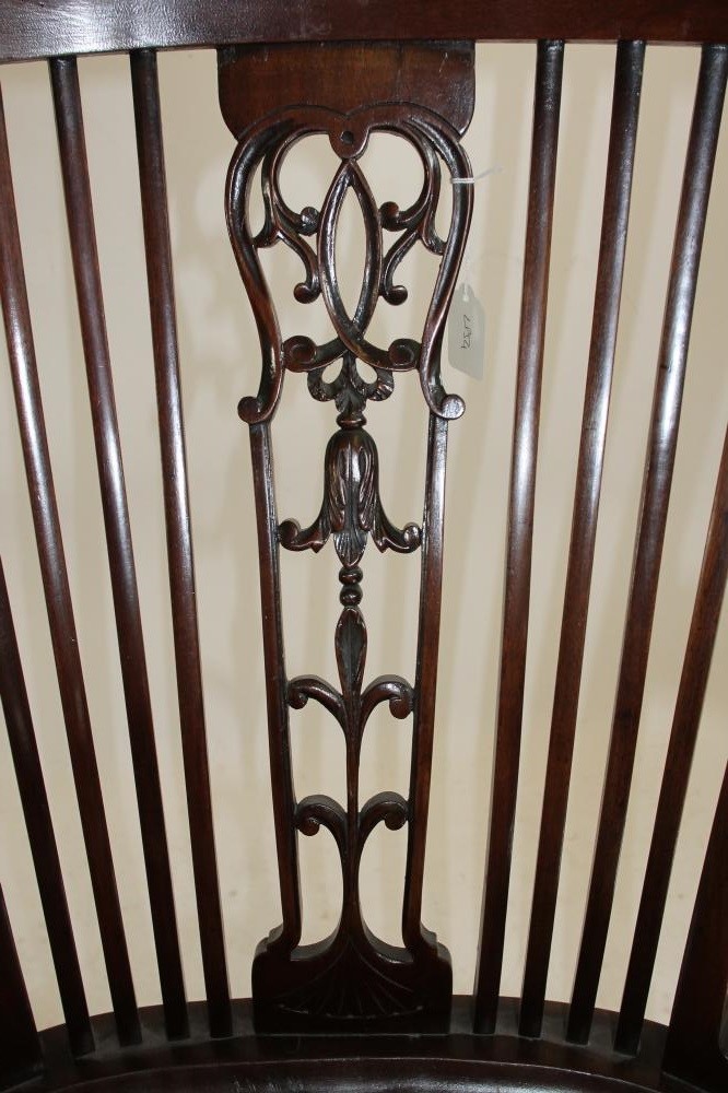 A CARVED MAHOGANY ELBOW CHAIR Image