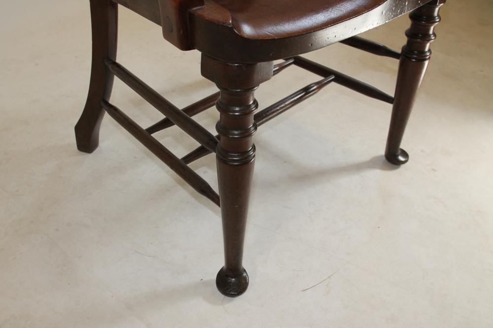 A CARVED MAHOGANY ELBOW CHAIR Image