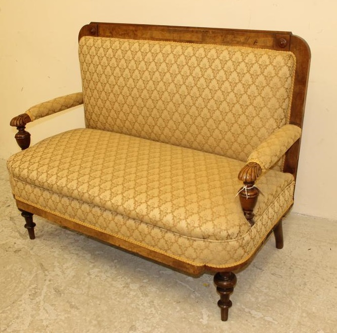 A VICTORIAN WALNUT FRAMED CLUB SETTEE upholstered in a cream weave Image