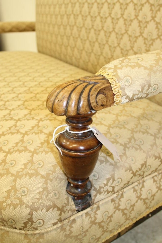 A VICTORIAN WALNUT FRAMED CLUB SETTEE upholstered in a cream weave Image
