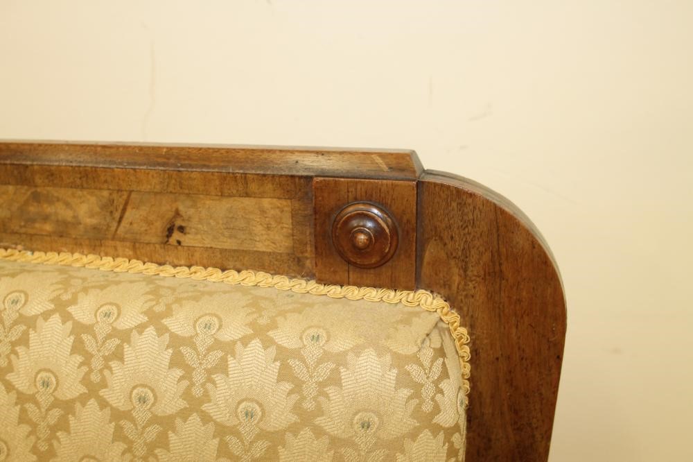 A VICTORIAN WALNUT FRAMED CLUB SETTEE upholstered in a cream weave Image