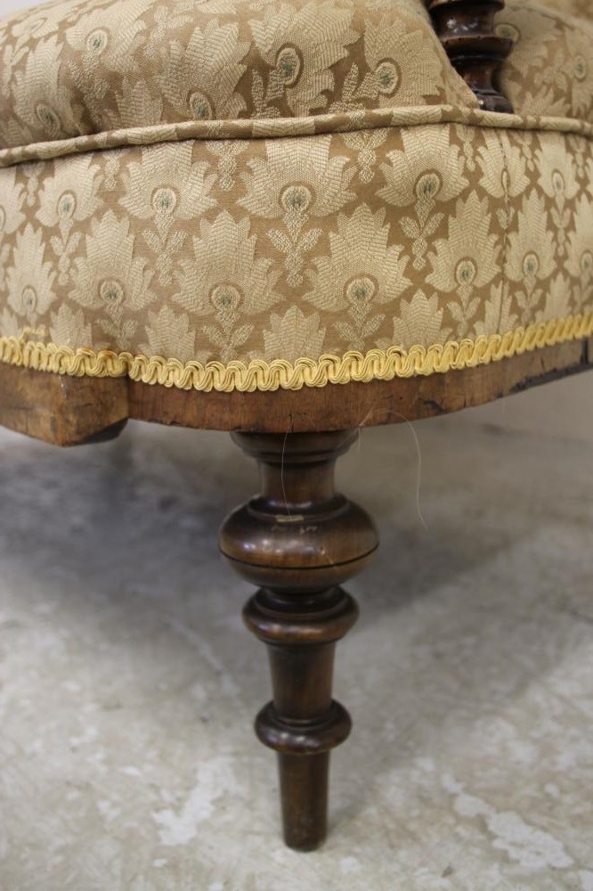A VICTORIAN WALNUT FRAMED CLUB SETTEE upholstered in a cream weave Image