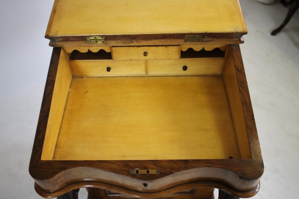 A VICTORIAN WALNUT DAVENPORT Image