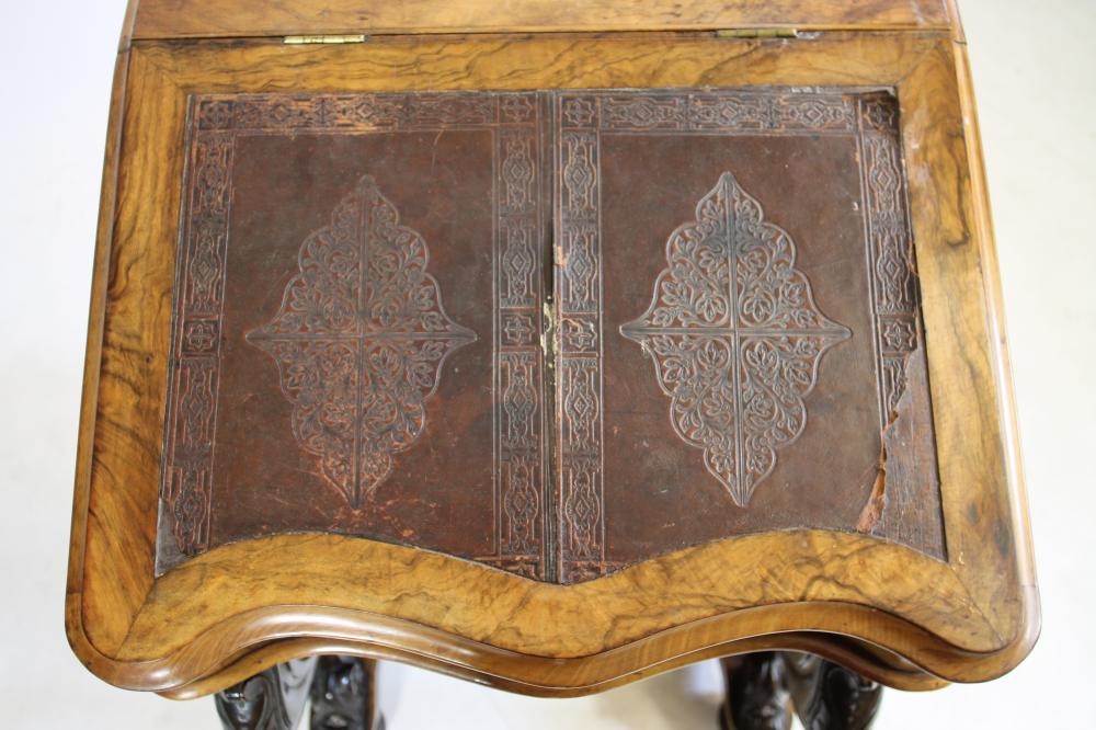 A VICTORIAN WALNUT DAVENPORT Image