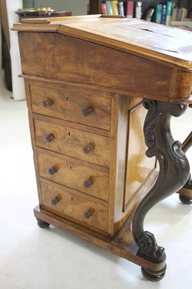 A VICTORIAN WALNUT DAVENPORT Image